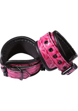 Sinful Adjustable Faux Leather Wrist Cuffs Pink, showcased with a quilted design and soft lining for comfort and style.