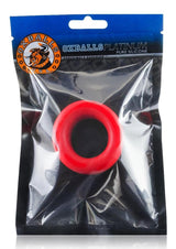 Oxballs Atomic Jock Balls-T Silicone Ball Stretcher Red in packaging, showcasing its flexible and comfortable design.