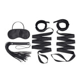 Lux Fetish 4 Piece Bondage Bed Strap Flogger Kit includes mask, flogger, and restraints for sensual play.