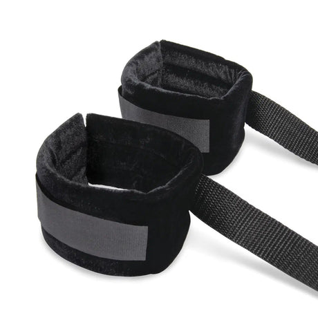 Lux Fetish 4 Piece Bondage Bed Strap Flogger Kit soft black wrist restraints with adjustable straps.