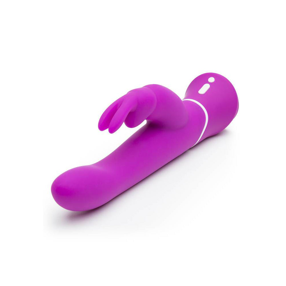 Happy Rabbit Curve Purple Rabbit Vibrator lying on a surface, showcasing its sleek design and bunny ears.