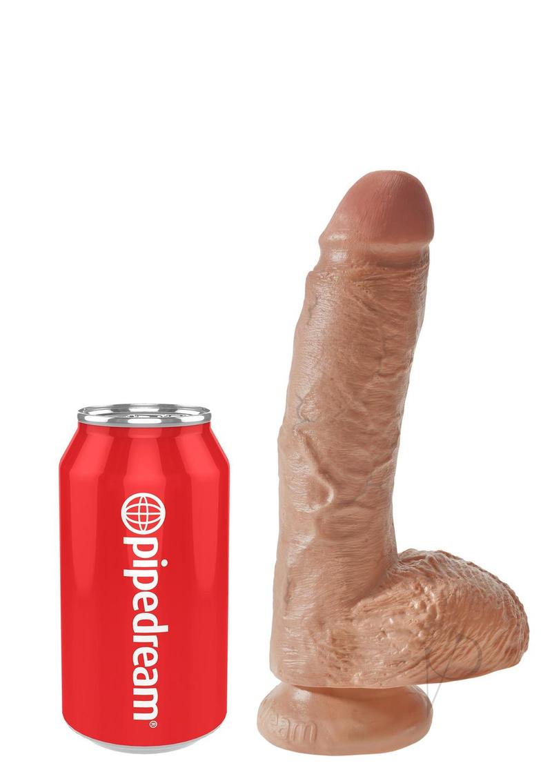 King Cock Dildo with Balls 8 inch Caramel next to a soda can for size comparison.