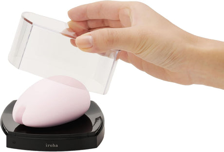 Tenga Iroha Sakura Clitoral Vibrator Pink being unboxed with its clear cover removed.