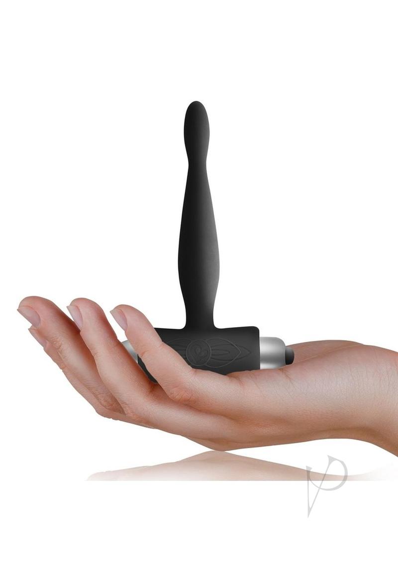 Petite Sensations Teazer Silicone Anal Stimulator Black held in hand, showcasing its streamlined design for anal pleasure.