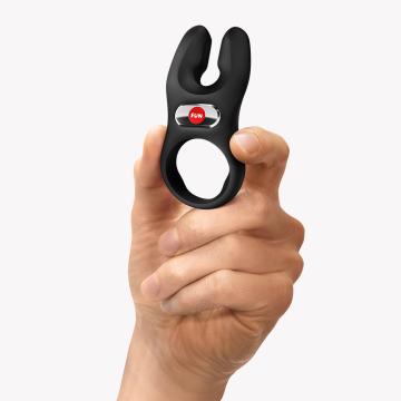 Image of Fun Factory NOS Vibrating Cock Ring Black held in hand, showcasing its unique ergonomic design.