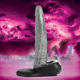 The Gargoyle Rock Hard Silicone Dildo Silver showcasing its textured shaft and firm base against a vibrant background.