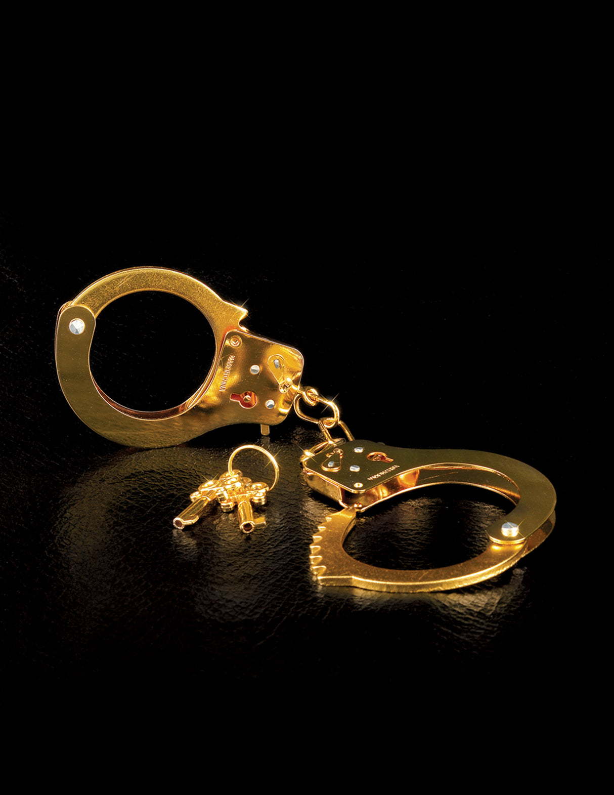 Fetish Fantasy Gold Metal Cuffs Gold with keys on a black background for stylish restraint.