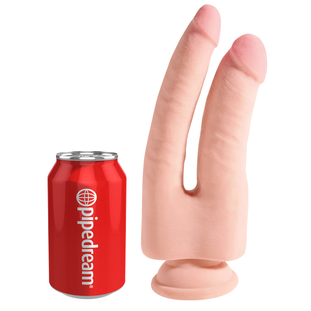 King Cock Plus 9.5 inch Triple Density Double Penetrator next to a soda can for size comparison.