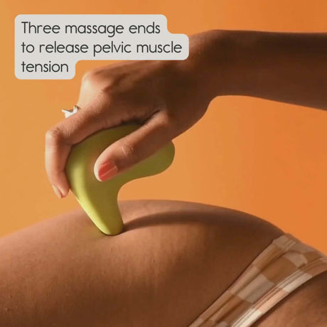 Person using Ohnut Kiwi Vibrating Personal Massager on their side to relieve pelvic muscle tension.
