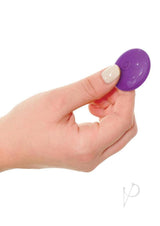 3Some Total Ecstasy Silicone Remote Vibrator Purple held in hand, showcasing its sleek design for pleasure and excitement.
