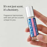 Pure Instinct Crave Pheromone Perfume Oil Roll-On 0.34 Oz held in hand against a text background.