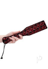 Ouch Luxury Diamond Pattern Paddle Burgundy held by a hand, showcasing its diamond pattern and stylish design.