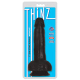 Thinz 7 Inch Slim Dong with Balls Midnight on packaging, showcasing lifelike look and feel for pleasurable experiences.