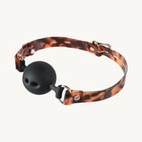 Sportsheets Amber Ball Gag Tortoiseshell Strap designed for fashionable bondage play.
