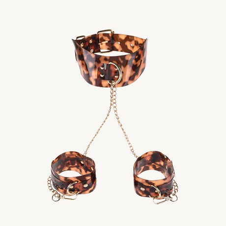Sincerely Amber Neck and Wrist Restraint featuring leopard print with gold-plated chains for stylish submission.