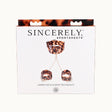 Sincerely Amber Neck and Wrist Restraint packaging featuring stylish neck strap and wrist cuffs.