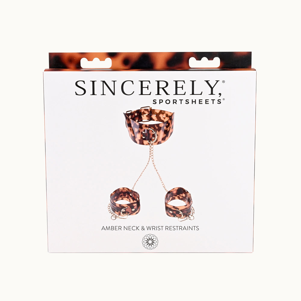 Sincerely Amber Neck and Wrist Restraint packaging featuring stylish neck strap and wrist cuffs.