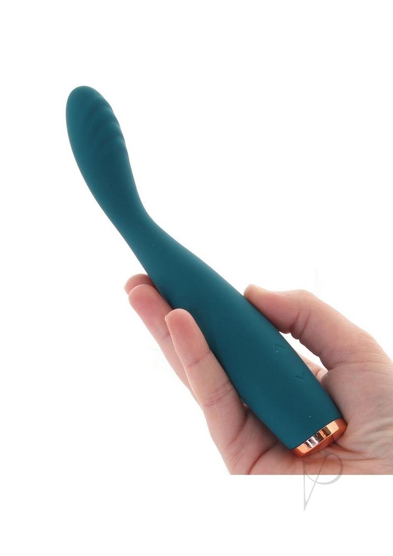 Luxe Lillie Silicone Slim Vibrator Teal held in hand showcasing its sleek design and flexible body.