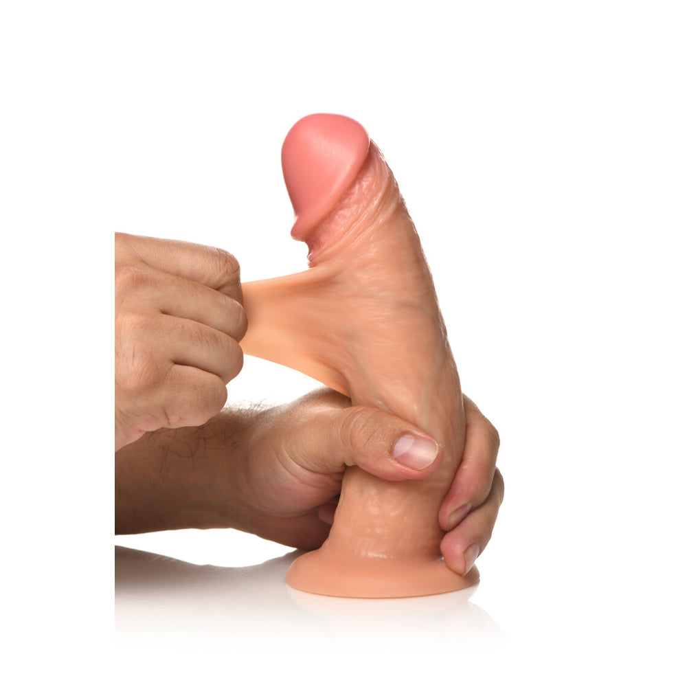 Jock 8 Inch Vibrating Realistic Skin Silicone Dildo Light held in hand, showcasing its lifelike texture and design.