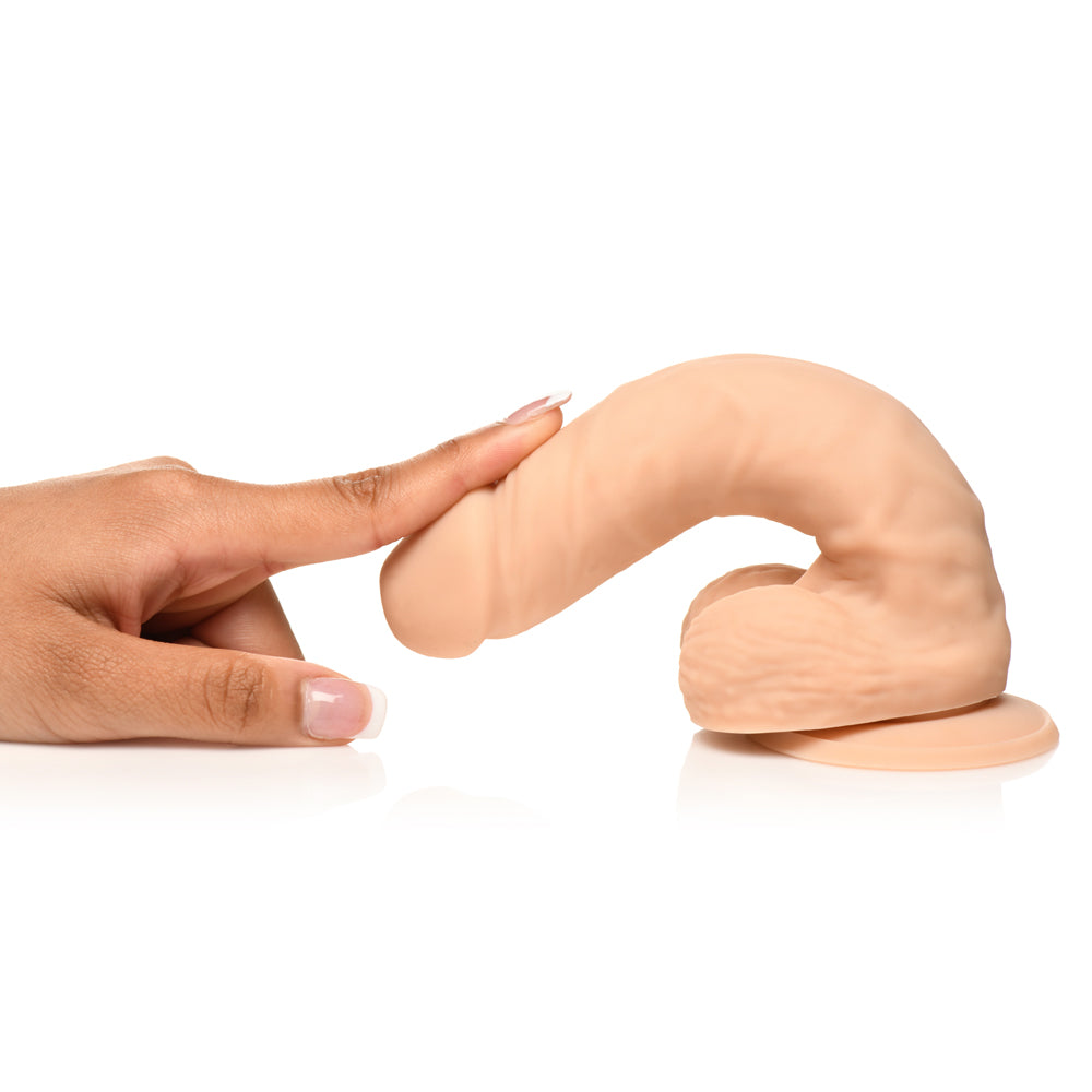 Easy Riders 7 Inch Silicone Dildo with Balls Light being touched, showcasing its realistic design and texture.