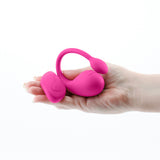 Inya Venus Vibrating Egg with Remote Control Pink, sleek rechargeable silicone vibrator in hand.