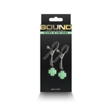 Bound Nipple Clamps G4 Gunmetal packaging with glowing dark elements for nipple play.