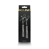 Bound Nipple Clamps D2 Gunmetal packaging showcasing nipple clamps with tassels for sensual play.