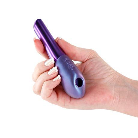 Seduction Nuvo Air Suction Stimulator Metallic Purple held in hand, highlighting its compact design and elegant finish.