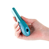 Seduction Nuvo Air Pulse Stimulator Metallic Teal held in hand, showcasing its sleek design and air pulse technology.