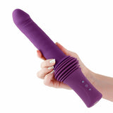Inya Super Stroker Thrusting Vibrator Purple held in hand, showcasing its design and features.