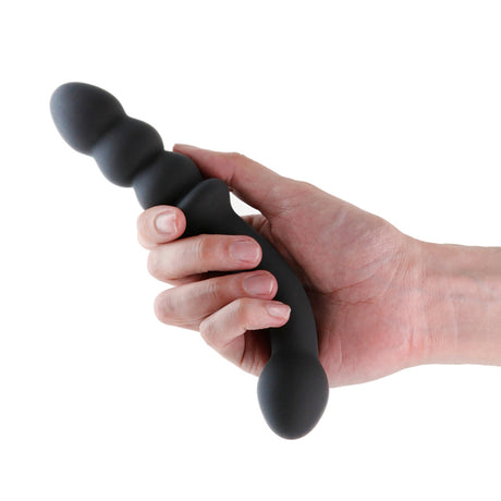 Renegade Duel Dual Ended Anal Vibrator Black held in hand, showcasing its unique design and features.