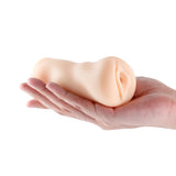Hustler's Barely Legal Christine Stroker White held in hand, showcasing its realistic and compact design.