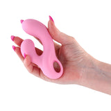 Gold-N-Dreams Agatha Rabbit Vibrator Rose Quartz held in hand, showcasing its compact design and silicone exterior.