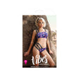 Fantasy Lingerie Spaced Out Bralette Panty Set M L displayed on a model with UV reactive print in a scenic outdoor setting.