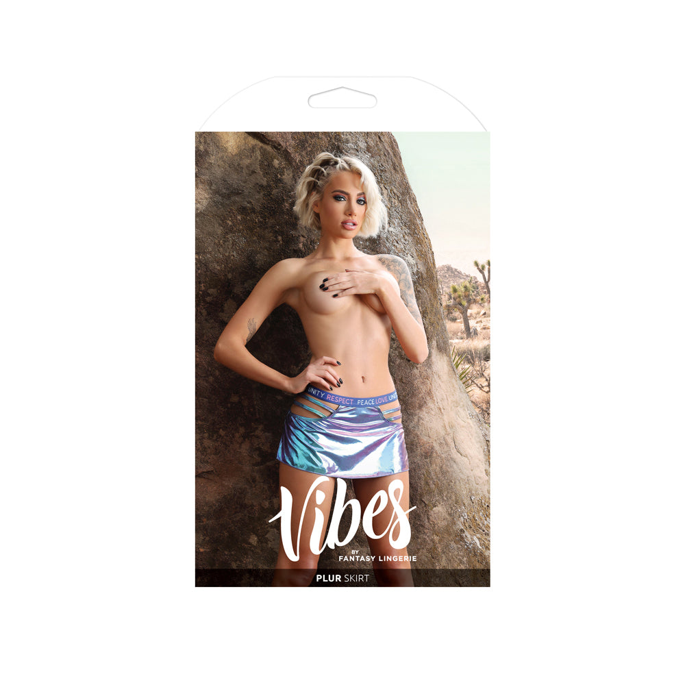 Fantasy Lingerie Plur Holographic Cut-Out Skirt M L packaging displayed on model in a desert setting.