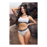 Model wearing Drippin' One-Shoulder Crop Top & Cheeky Panty S M, showcasing iridescent mesh and playful design.