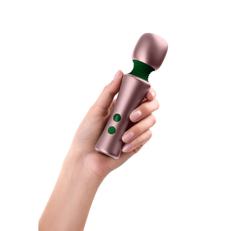 Femmefunn Bougie Wand Massager Rose Gold in a hand, showcasing its sleek design and luxurious features.