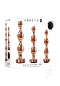Gender X Gold Digger 3 Piece Anal Plug Set Rose Gold featuring sculptural metal plugs with black gem bottoms.