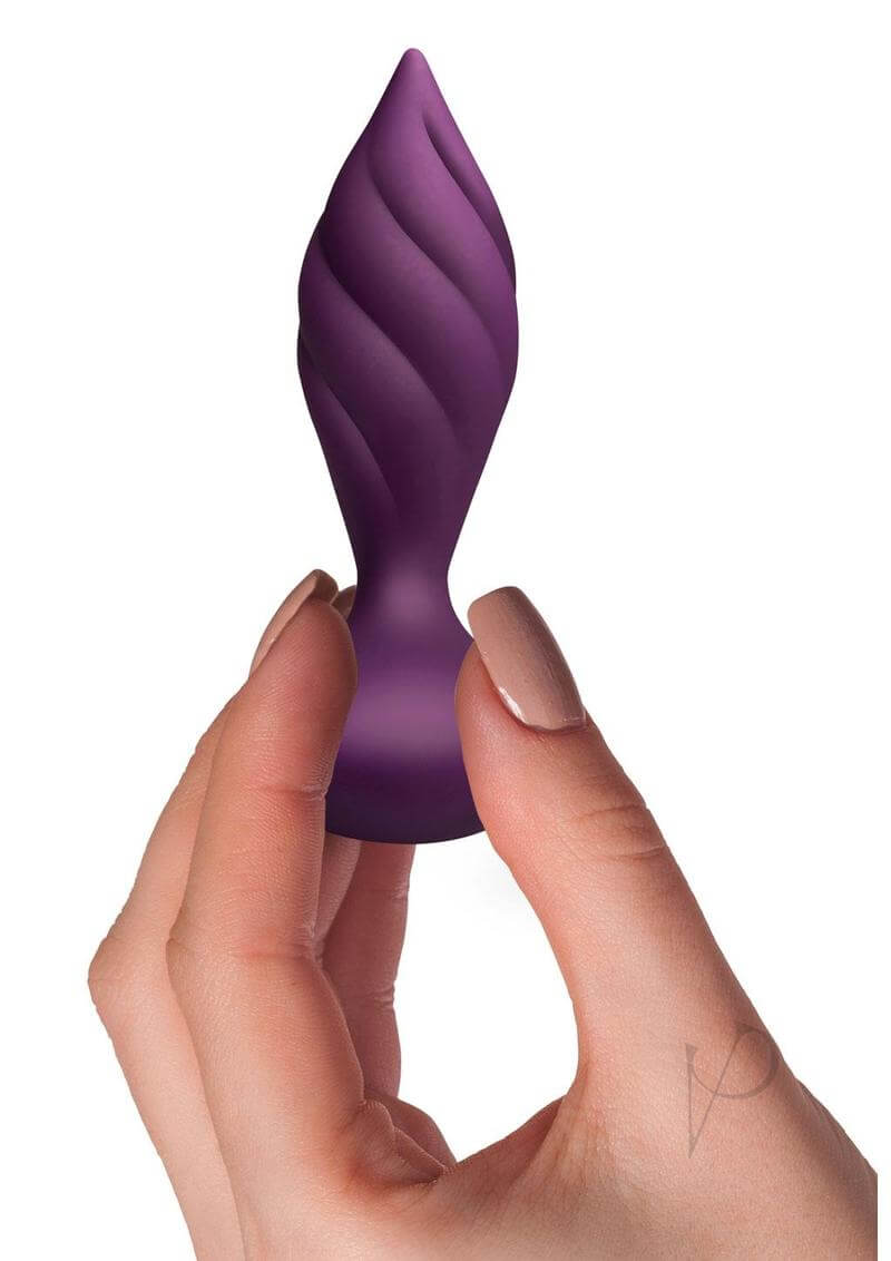 Rocks Off Desire Silicone Remote Anal Plug Rose Gold held in hand, showcasing elegant design and tapered tip for anal play.