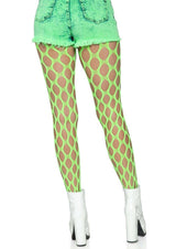 Leg Avenue Jumbo Pothole Net Tights OS Neon Green worn with denim shorts and white heels.