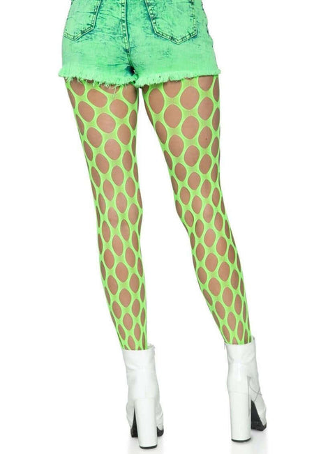 Leg Avenue Jumbo Pothole Net Tights OS Neon Green worn with denim shorts and white heels.