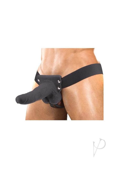 Erection Assistant Hollow Vibrating Strap-On 6 inch Black worn on a model, showcasing versatile harness design.