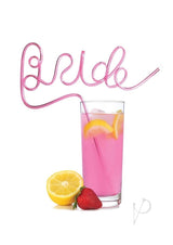 Glitterati Bride Twisty Straw Pink in a glass with pink drink, lemon, and strawberry.