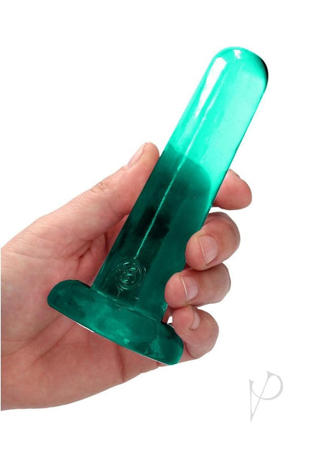 RealRock Crystal Clear Dildo with Suction Cup 5.3 inch held in hand, showcasing its transparent design.