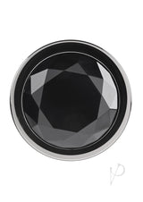 Close-up of the black gem of the Gender X Black Pearl Aluminum Anal Plug Smoke, featuring a faceted design.