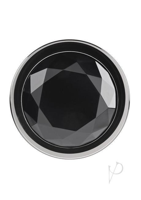 Close-up of the black gem of the Gender X Black Pearl Aluminum Anal Plug Smoke, featuring a faceted design.