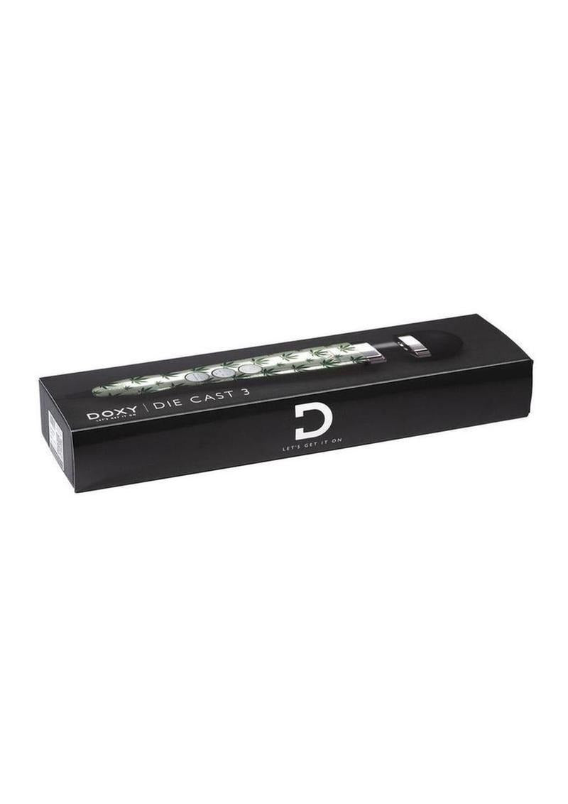 Doxy Die Cast 3 Wand Plug-In Wand Massager Cannabis Pattern packaging on a black background.
