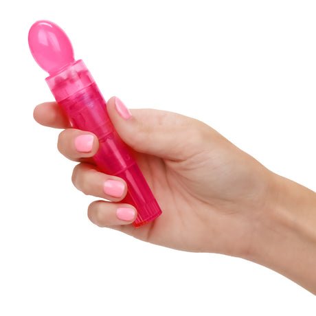Utopia Travel Massager Set Pink held in hand, highlighting its compact design and vibrant color.