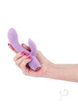 Obsessions Juliet Silicone Rabbit Vibrator Lavender held in hand with pink nails.
