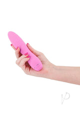 Obsessions Clyde Rechargeable Silicone Vibrator Pink held in a hand, showcasing its smooth design and vibrant color.